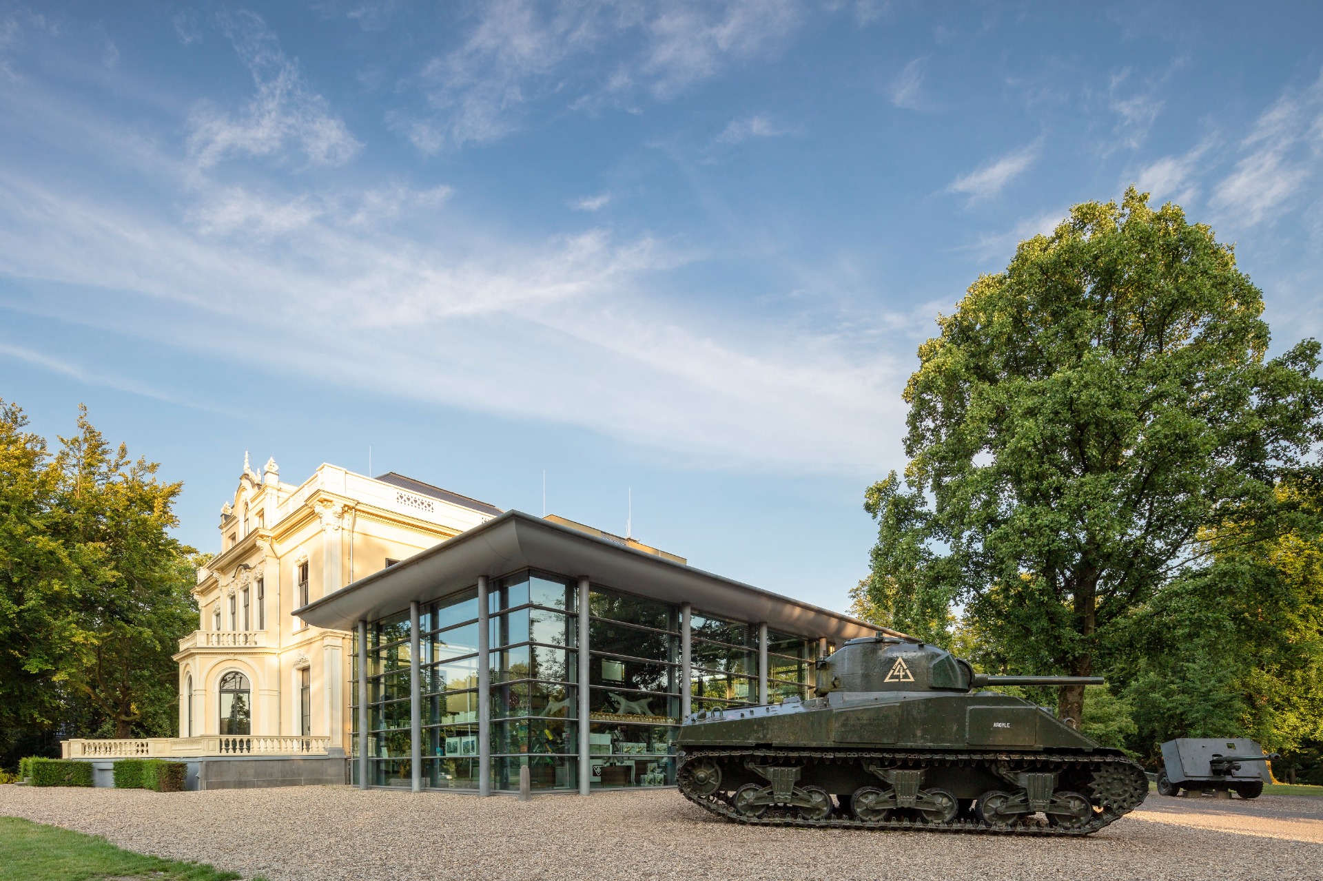 Two tanks stand in front of the Airborne Museum at Villa Hartenstein