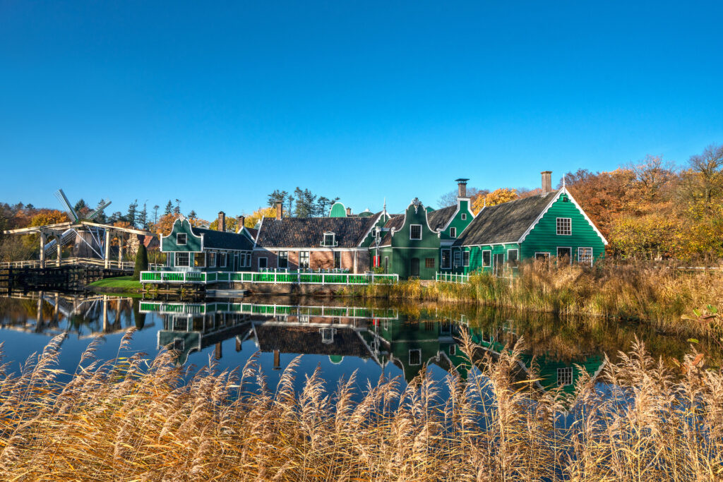 Zaans cottages on a pond at the Dutch Open Air Museum in Arnhem